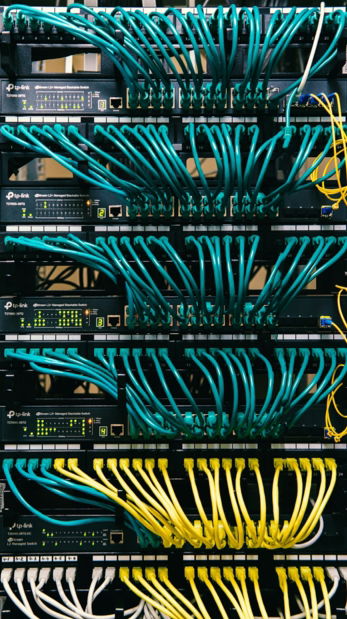 a rack of servers with wires and wires attached to them