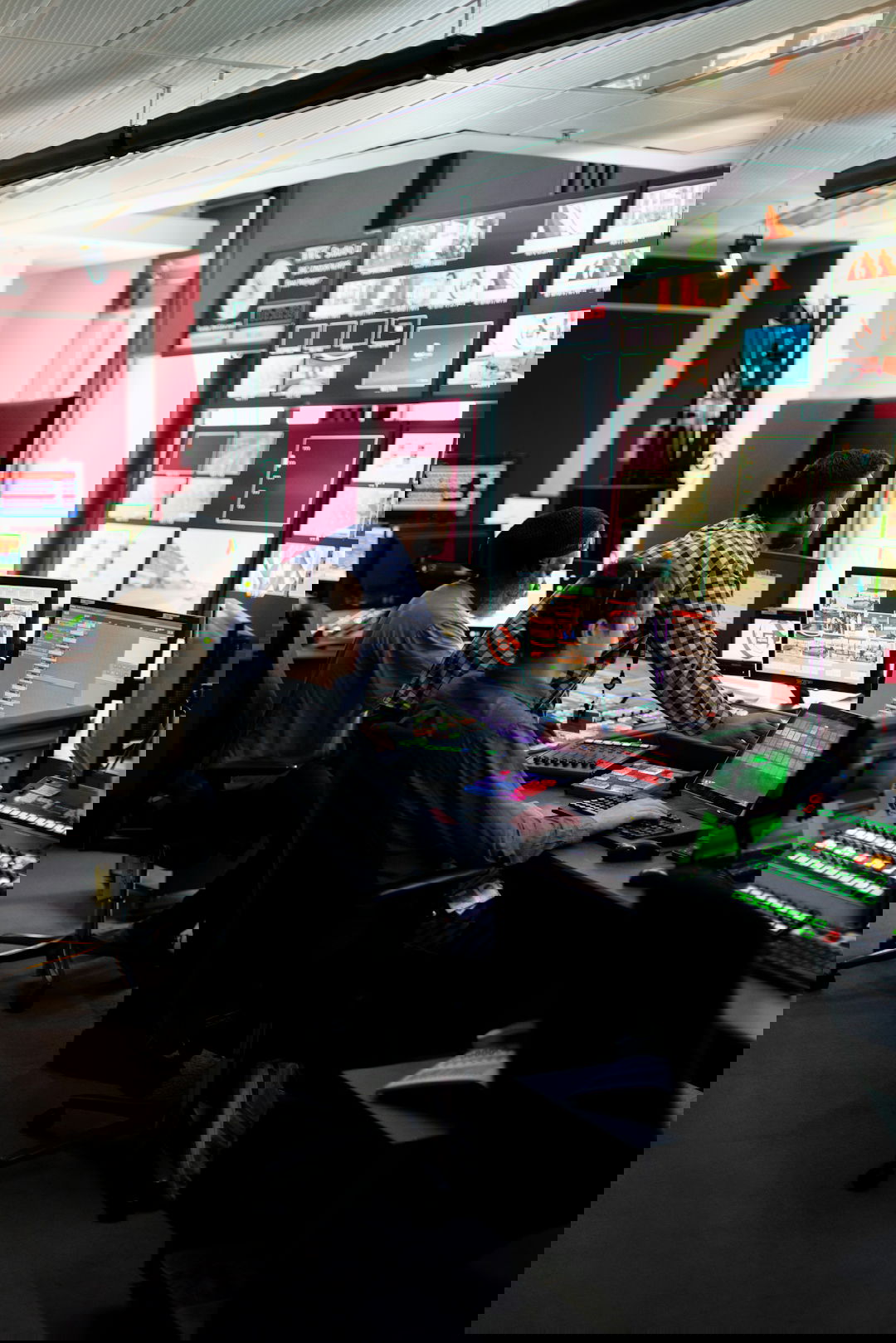 man in black and white checkered dress shirt sitting on black office rolling chair